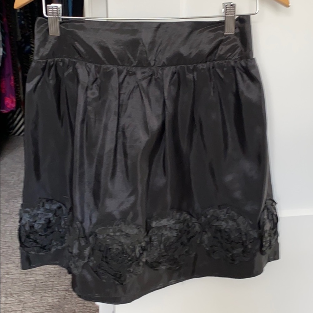 Lightweight black mini skirt with flower detail